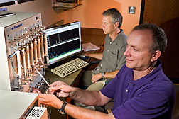 Using gas chromatography and mass spectrometry, plant physiologist (left) and technician analyze volatile apple compounds that contribute to both aroma and flavor: Click here for full photo caption.